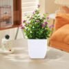 8ef9f53d-db4d-41fe-a935-ed07e2365c16.d6dc3fcd48bc6bcb64418ac7664e7bf1_converted.jpg Small Artificial Potted Plant with Flowers – Green