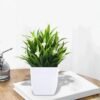 e0f433ad-c6ee-4335-bcbe-51f0b1b55089.bc79f4fc5d1883de7d3a2098256d7ad1_converted.jpg Small Artificial Potted Plant with Flowers – Green